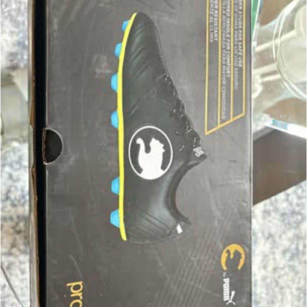 Puma Black Cleats with Blue and Yellow Accents